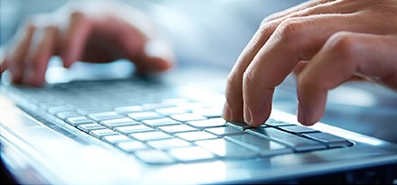 Male hands at keyboard