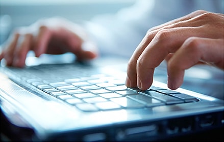 Male hands at keyboard Male hands at keyboard